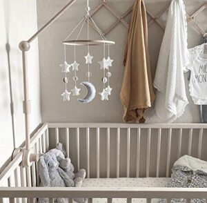 wooden moon and stars crib mobile in neutral tones, celestial nursery decor above crib, minimal baby room mobile grey white cream design