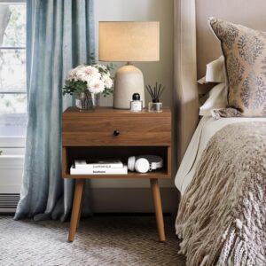 mid century modern nightstand in cozy bedroom