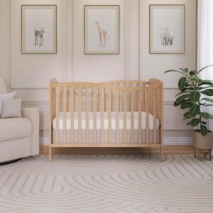 natural wood convertible baby crib in jungle nursery, modern nursery furniture in neutral tones, minimalist crib for safari themed baby room