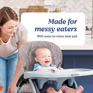 Graco Slim Snacker ultra-slim high chair with multiple recline positions in a modern nursery

