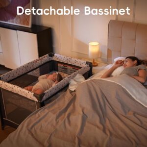 Pamo Babe portable pack and play with bassinet set up in a chic nursery for newborn sleep and play
