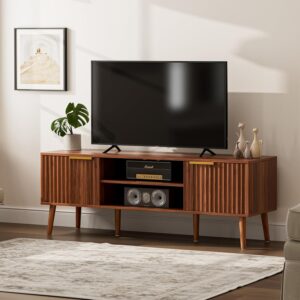 Mid-century modern TV stand with fluted cabinet doors and open shelves in walnut for living room