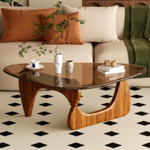 Mid-century modern coffee table with glass top and wooden base in warm walnut tone