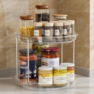 2 tier lazy susan organizer with condiments and sauces for easy access in kitchen cabinet