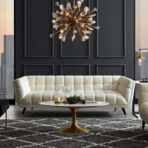 Elegant mid-century modern velvet sofa in ivory with tufted backrest and clean lines