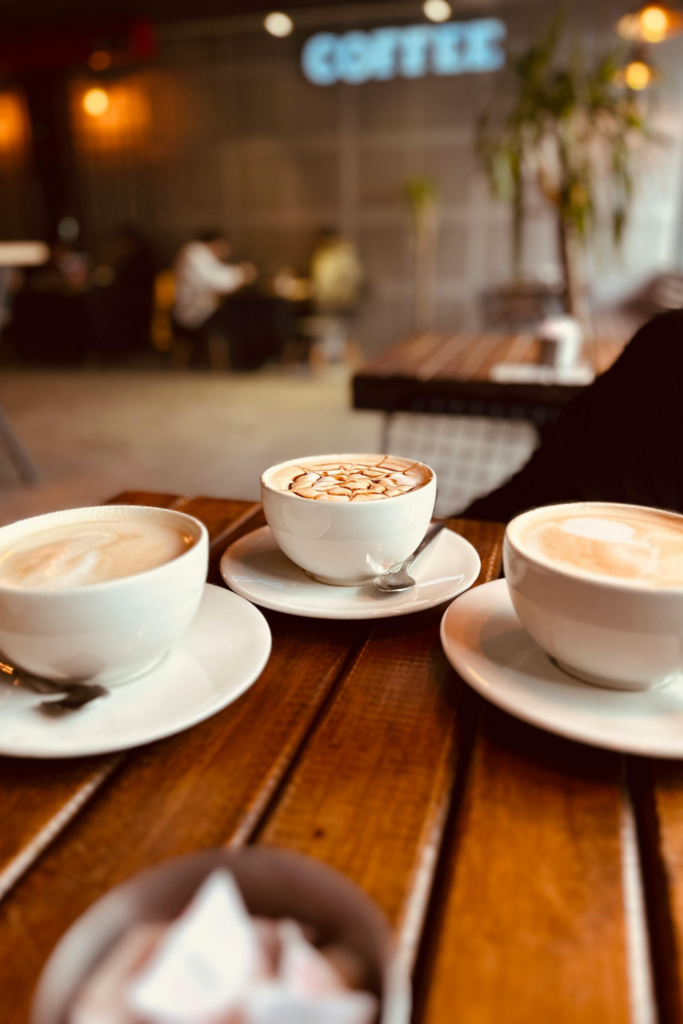 Cappuccinos displayed on a stylish coffee table in a cozy living room