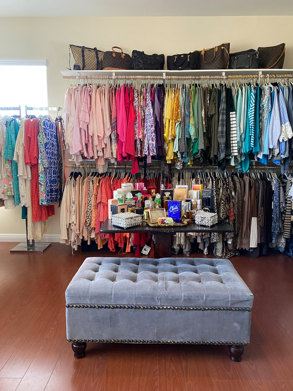 Professionally organized closet with color-coordinated clothing arranged for easy access and everyday functionality.