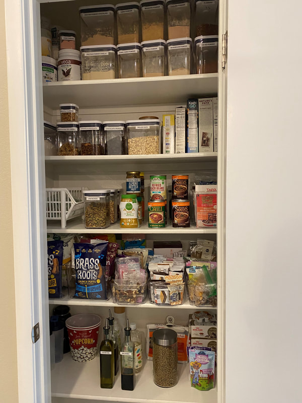 Organized pantry with labeled storage containers, designated food zones, and an easy-to-maintain organization system.